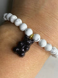 Natural gemstone bracelet with black resin gummy bear.