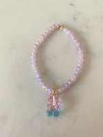 Pink bead bracelet with gummy bear charm