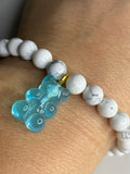 Natural gemstone bracelet with blue resin gummy bear.