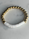 White heishi beads with gold plated hematite beads