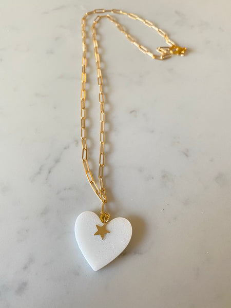 Handmade resin heart on 16k gold plated chain.