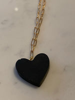 Gold plated paperclip chain necklace with black resin heart